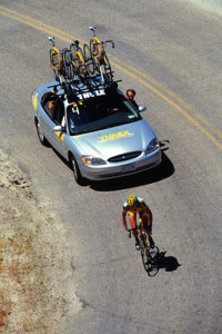 A lone rider climbs Old Freeze Out hill as her support crew offers encouragement in 2000.