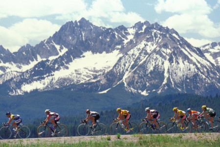 Riders cross in front of the Sawtooth Mountains as they enter the valley toward the finish in Stanley in 2002.