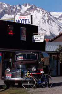 A truck, bike, and the Sawtooth Mountains.